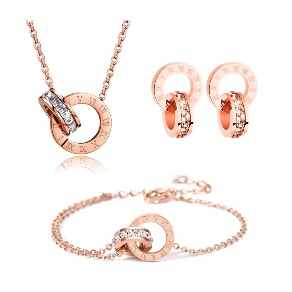 RPAEOY Set Gioielli Numeri Romani in Acciaio Inossidabile Placcato Oro 18K con Zircone, Collana, Orecchini e Bracciale (Oro Rosa) - immagine 1