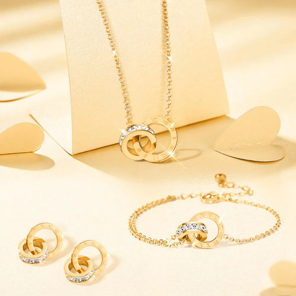 RPAEOY Set Gioielli Numeri Romani in Acciaio Inossidabile Placcato Oro 18K con Zircone, Collana Orecchini e Bracciale (Oro) - immagine 2
