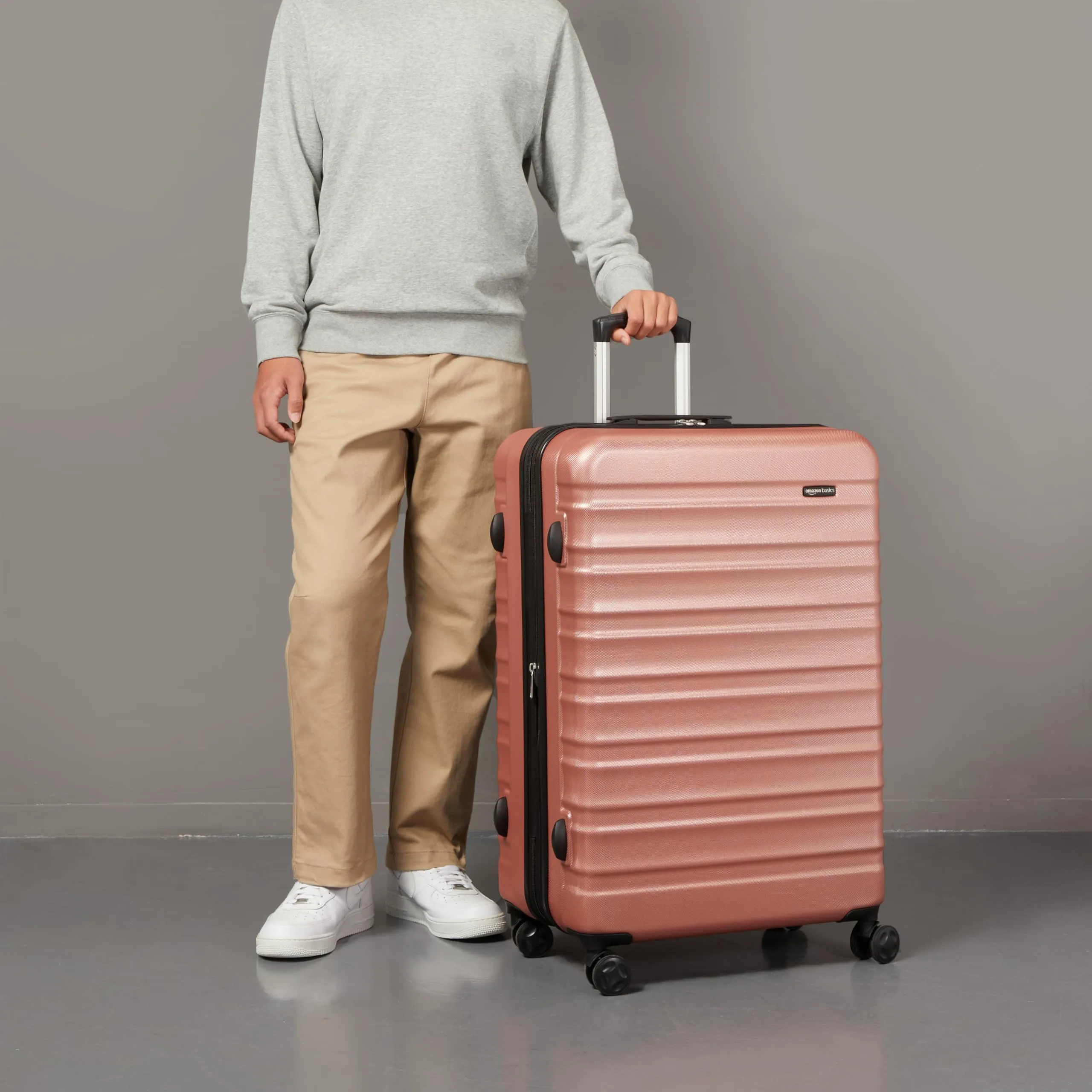 Amazon Basics Valigia Rigida Grande Espandibile in ABS, 4 Ruote Doppie, 78 x 52,6 x 32 cm - Oro Rosa - immagine 5