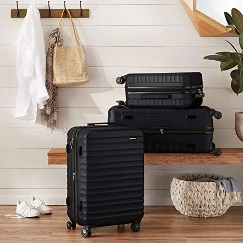 Amazon Basics Valigia Rigida Piccola Espandibile in ABS, 4 Ruote Doppie, 55 x 37,5 x 25,5cm - Nero - immagine 7