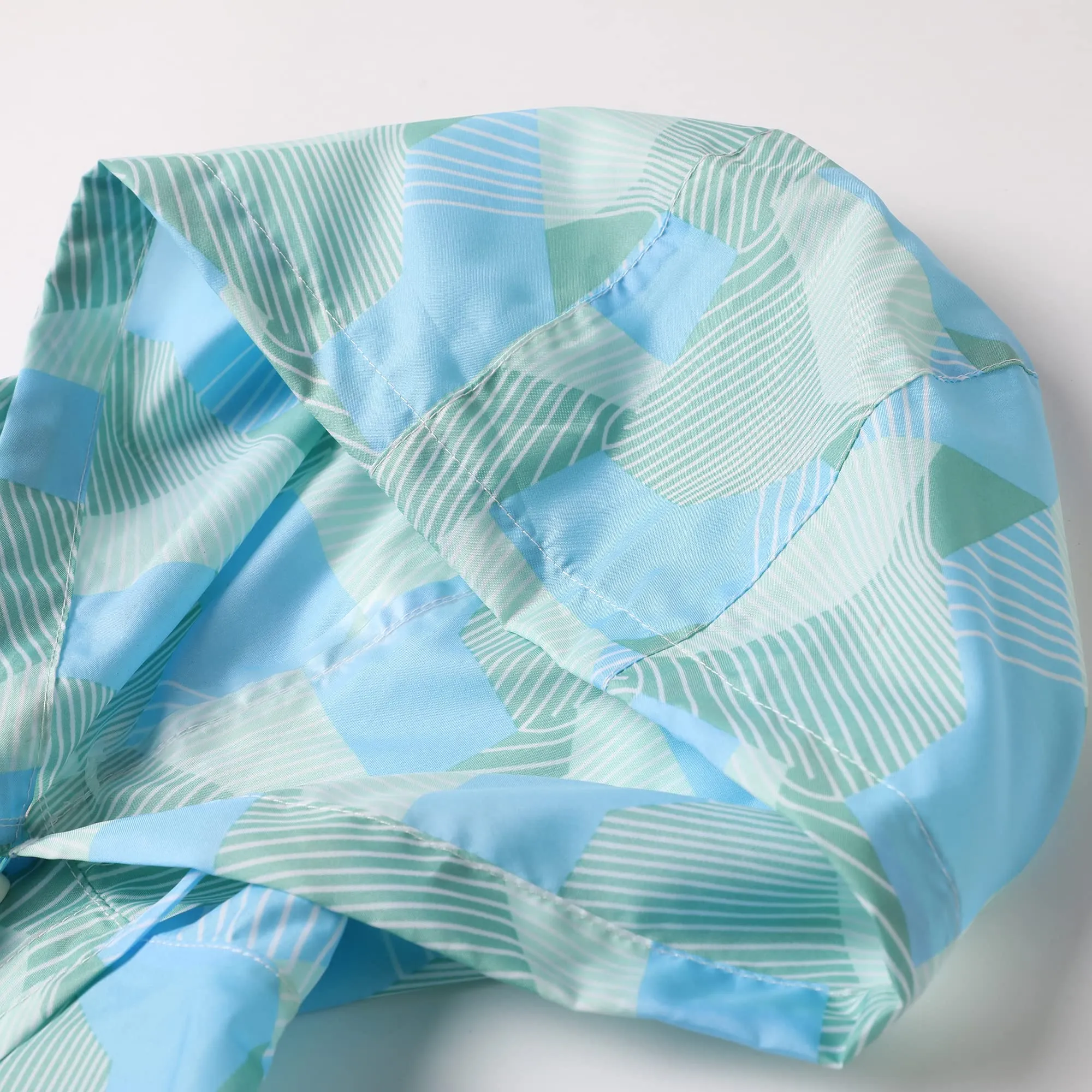 QIKADO Mantello Impermeabile Bambini Poncho Antivento e Antipioggia con Sacchetto, Blu Geometrico, XL (9-12 anni) - immagine 2