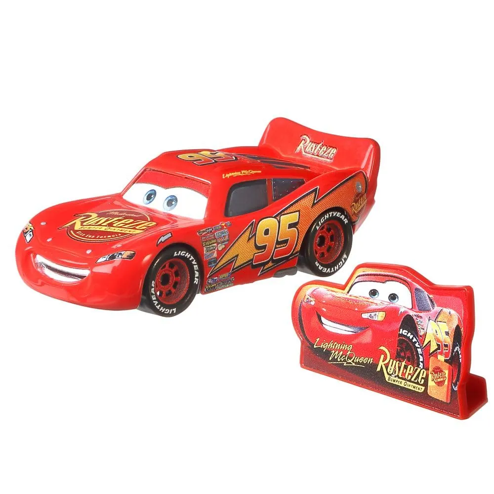 Mattel Disney Cars Racing Style 1:55 Die-Cast Lightning McQueen Rust-Eze Sign DXV29N CDXV59 - immagine 2