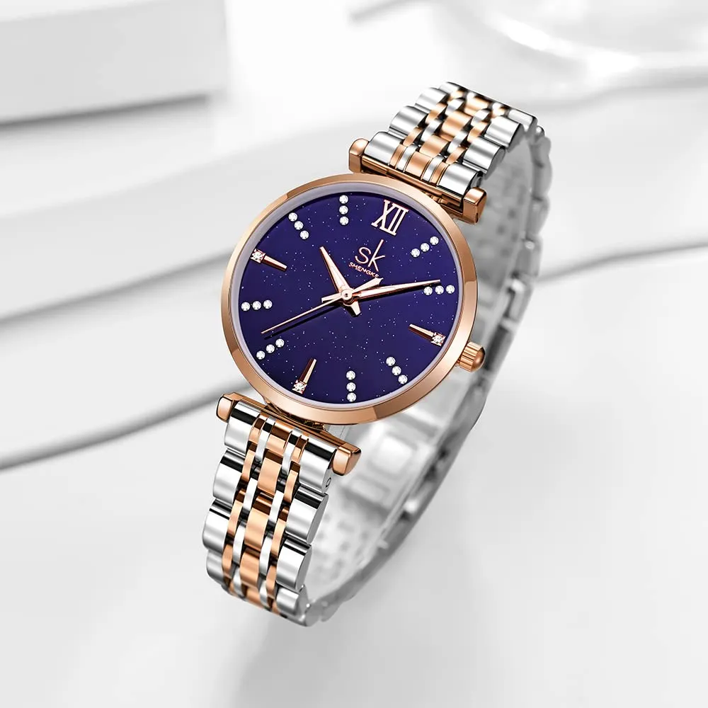 SHENGKE SK Classic Donne Orologi Moda Donne Dress Watch Solido Acciaio Inox Band Cinturino in Vera Pelle (Blue-Starry) - immagine 2
