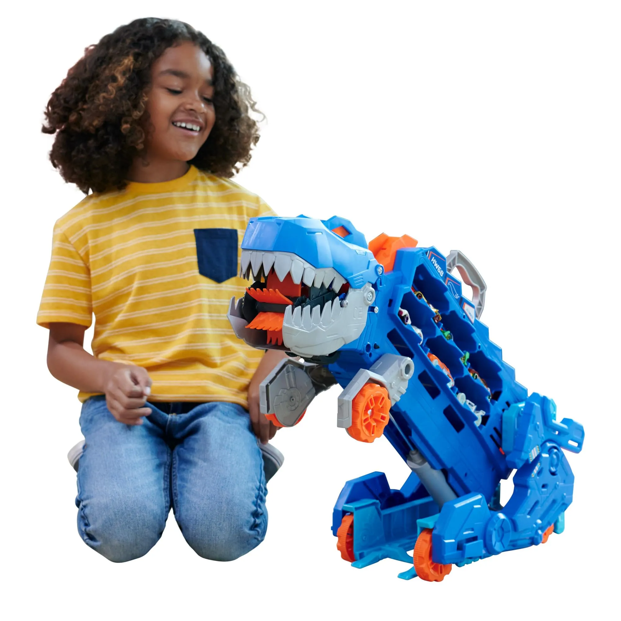 ​Hot Wheels City 'Let's Race' Netflix - Mega Dino Trasportatore, pista da corsa che si trasforma in un T-Rex, playset con luci e suoni, box per riporre 20 macchinine in scala 1:64, 4+ anni, HNG50