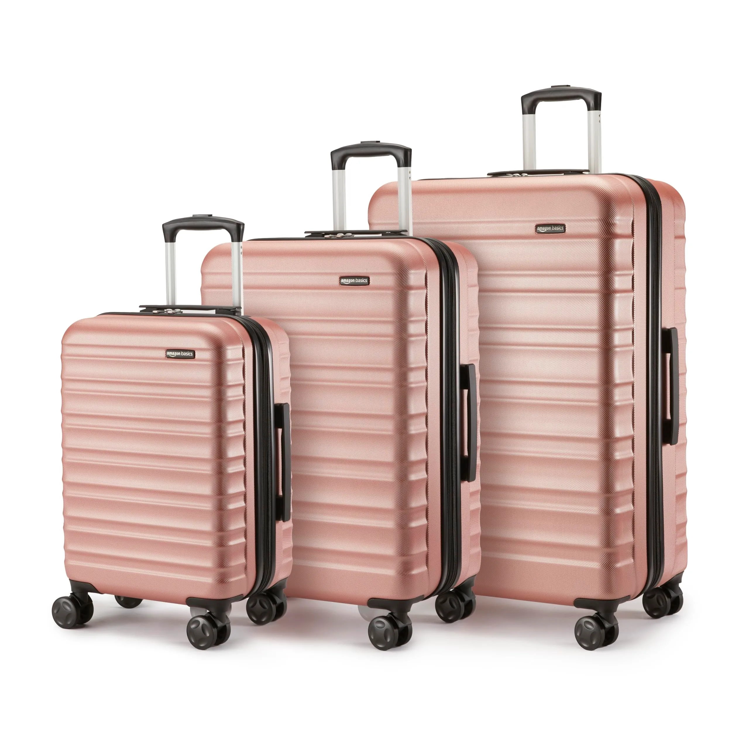 Amazon Basics Set Valigie Rigide (Piccola + Media + Grande) - Bagagli Espandibili ABS con 4 Ruote Doppie Girevoli - Resistenti ai Graffi e Leggeri - Oro Rosa